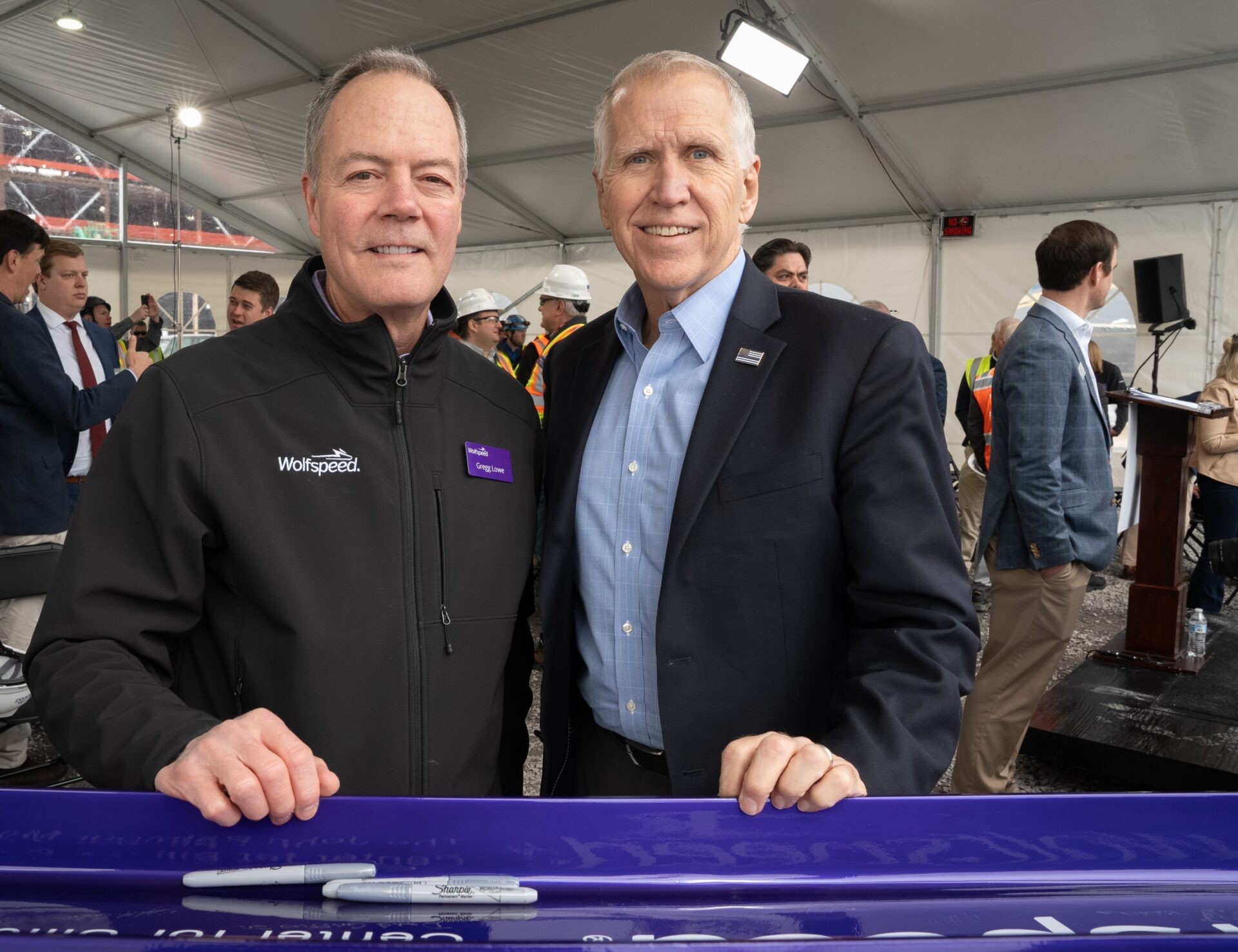 Senator Thom Tillis (R-NC) joined Wolfspeed President and CEO Gregg Lowe in signing ceremonial “last beam” at the Topping Out ceremony for The John Palmour Manufacturing Center for Silicon Carbide
